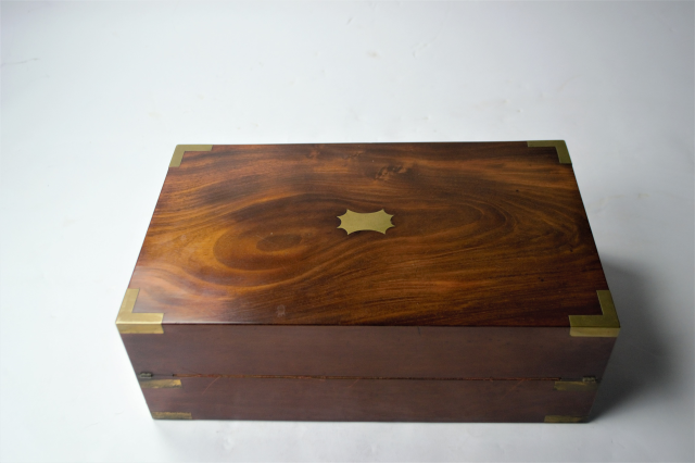 Discover our collection of mid 19th century mahogany writing desks! This piece features an ink pot and is in great condition. Shop now and add a classic touch to your home.