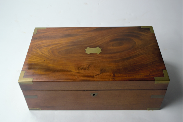 Discover our collection of mid 19th century mahogany writing desks! This piece features an ink pot and is in great condition. Shop now and add a classic touch to your home.