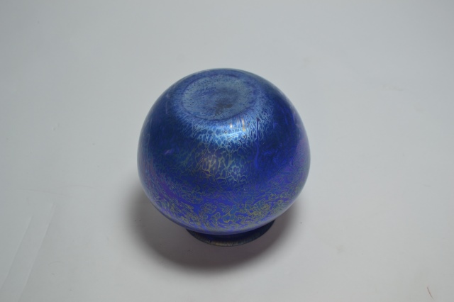 Explore our stunning range of Royal Brierley studio glass, featuring captivating blue, iridescent designs. Standing at 18cm high, it's the perfect addition to any decor. Shop now!