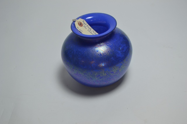 Explore our stunning range of Royal Brierley studio glass, featuring captivating blue, iridescent designs. Standing at 18cm high, it's the perfect addition to any decor. Shop now!