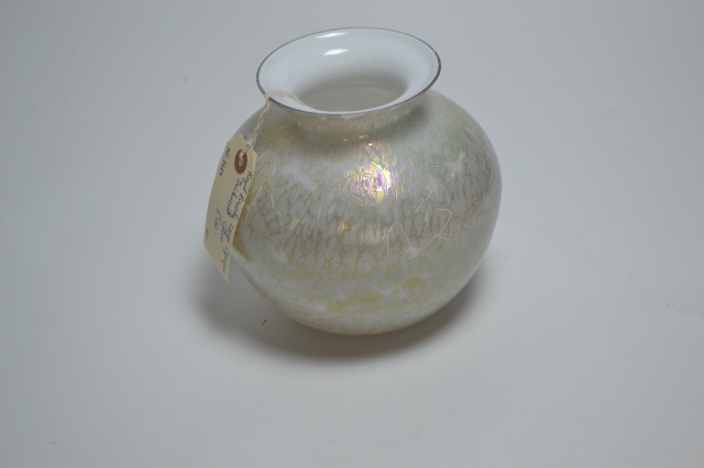 Discover our range of stunning Royal Brierley blue iridescent glass. Standing proudly at 18cm high, it's the perfect piece for any collection. Shop now and transform your space!