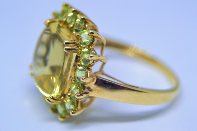 A 9ct Gold With Peridot Cluster Ring.
