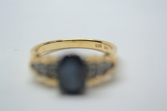 A 14k Gold Sapphire and Diamond Ring. 