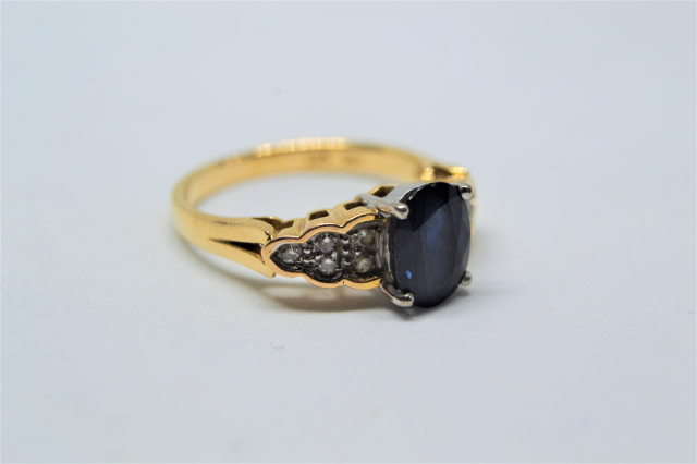 A 14k Gold Sapphire and Diamond Ring. 
