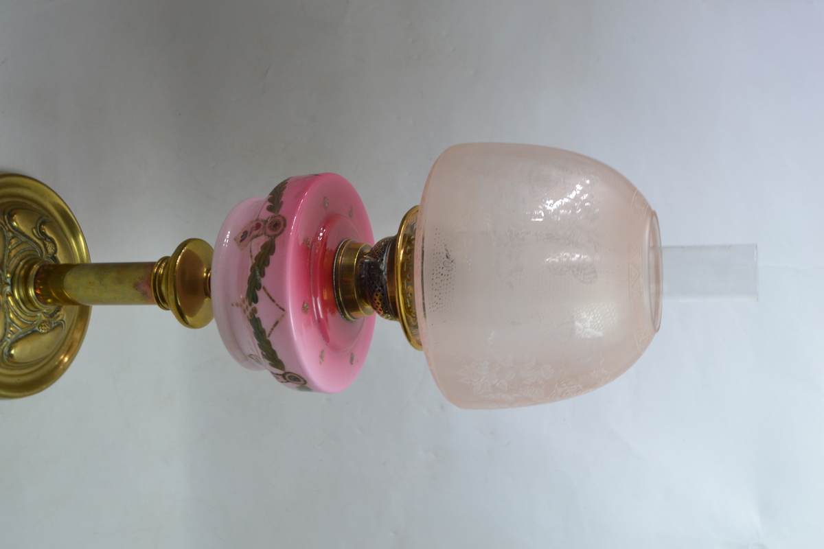 Discover our collection of exquisite Victorian cranberry glass oil lamps. This particular 27 piece boasts a unique wooden and brass stand. Shop now for antique treasures!