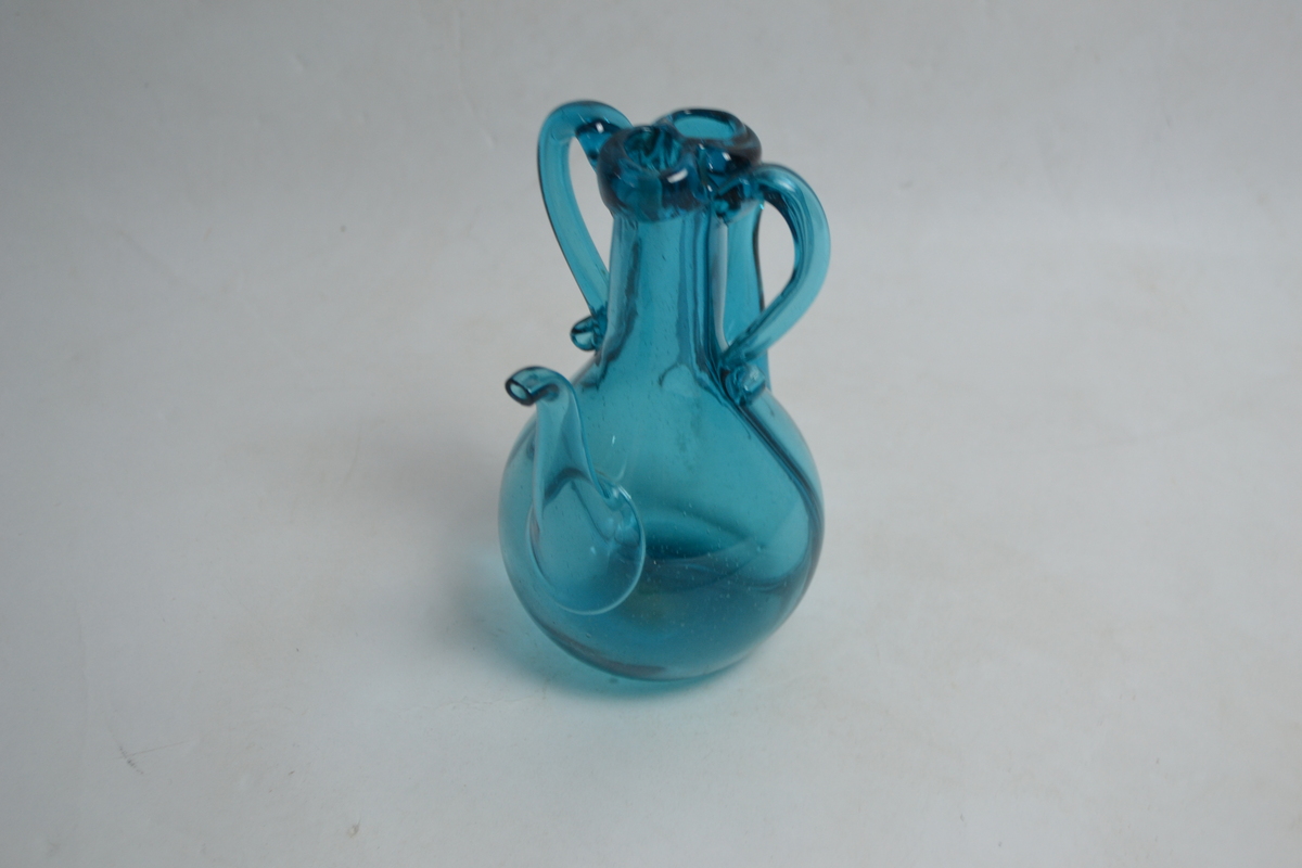 Discover our collection of 19th century Bristol green handblown vinegar bottles. Perfect for antique enthusiasts! Shop now and add a piece of history to your collection.