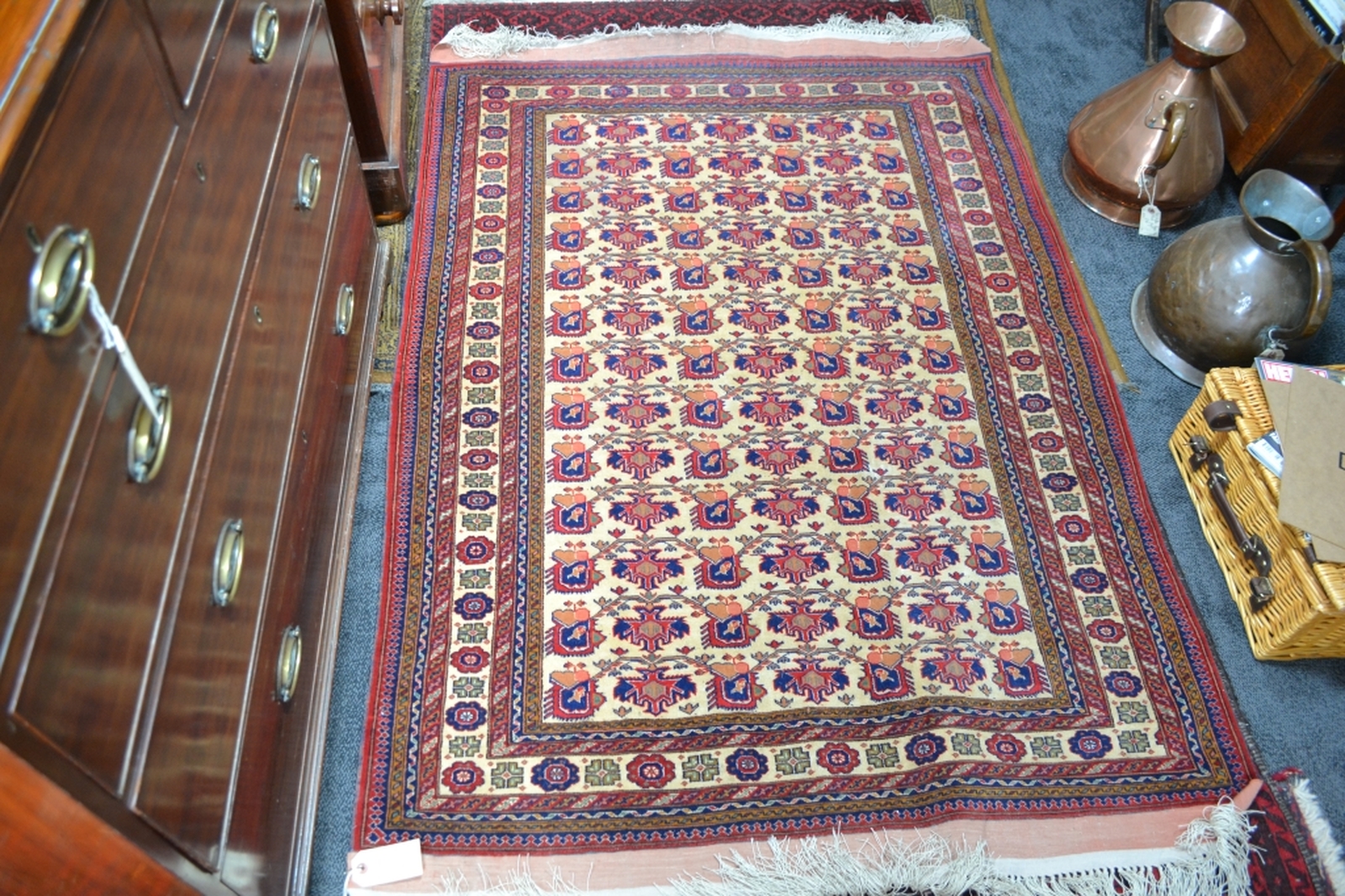 Discover our wide range of Turkish fringed carpets in cream ground with intricate designs in red and blue. Order now to enhance your home's aesthetic appeal!
