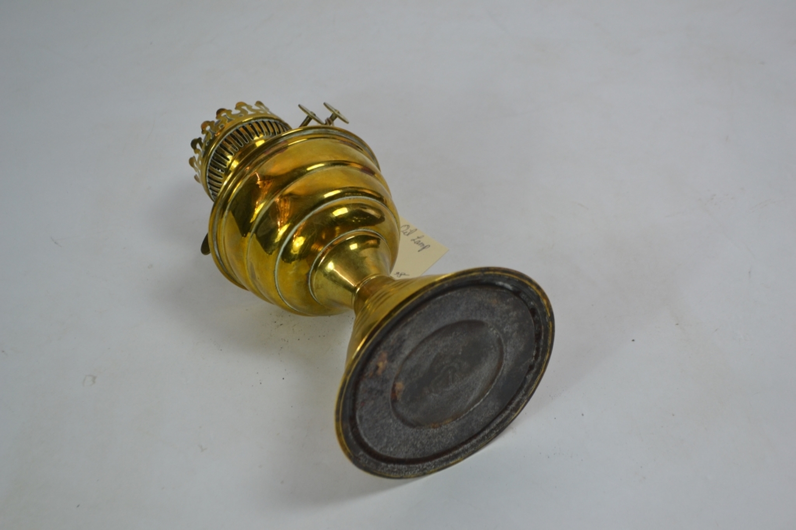 Brass oil lamp early 20th century of lobed baluster form with a typical plain glass chimney
