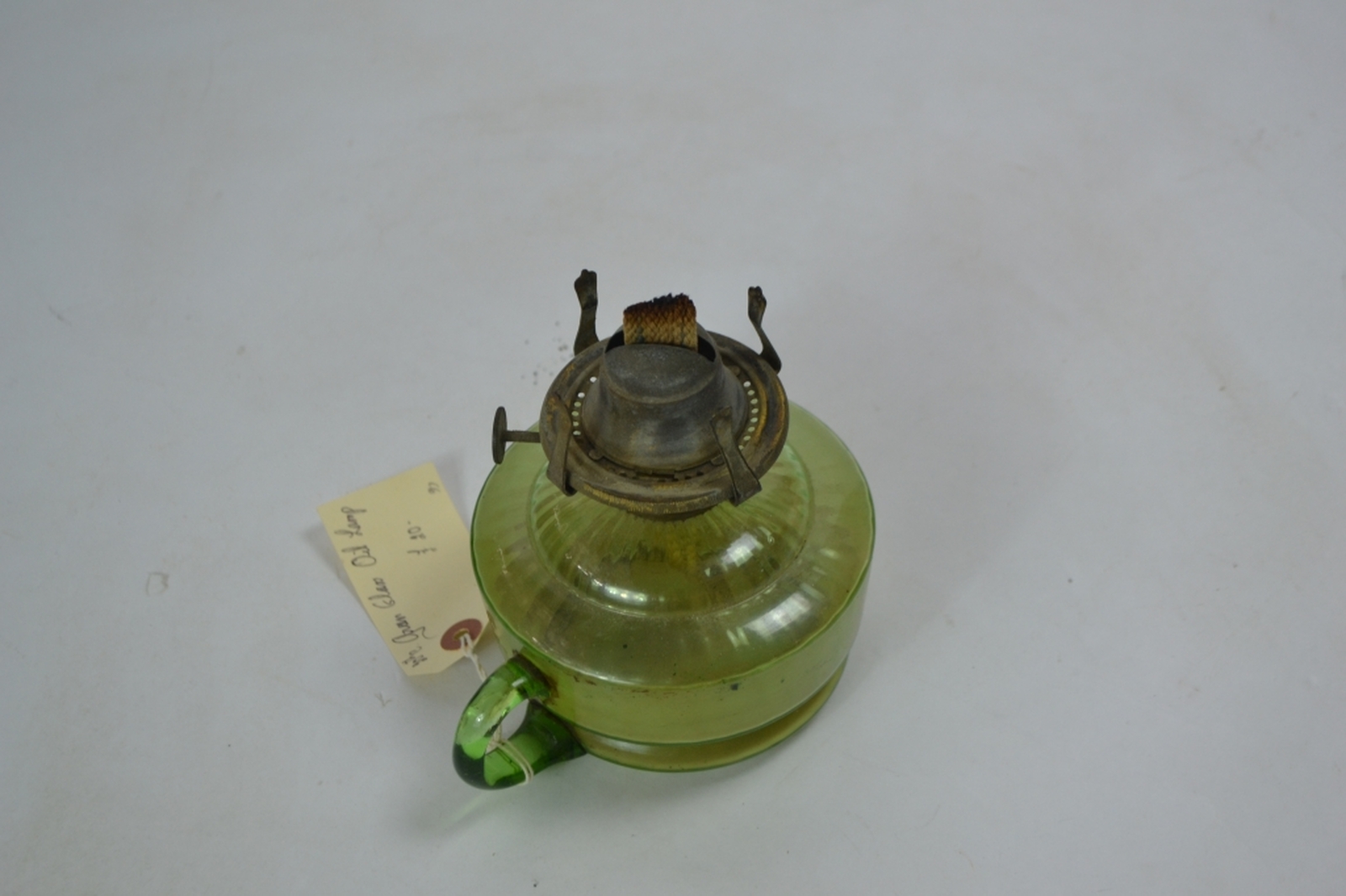 Early 20th century oil lamp with Incandescent green reservoir