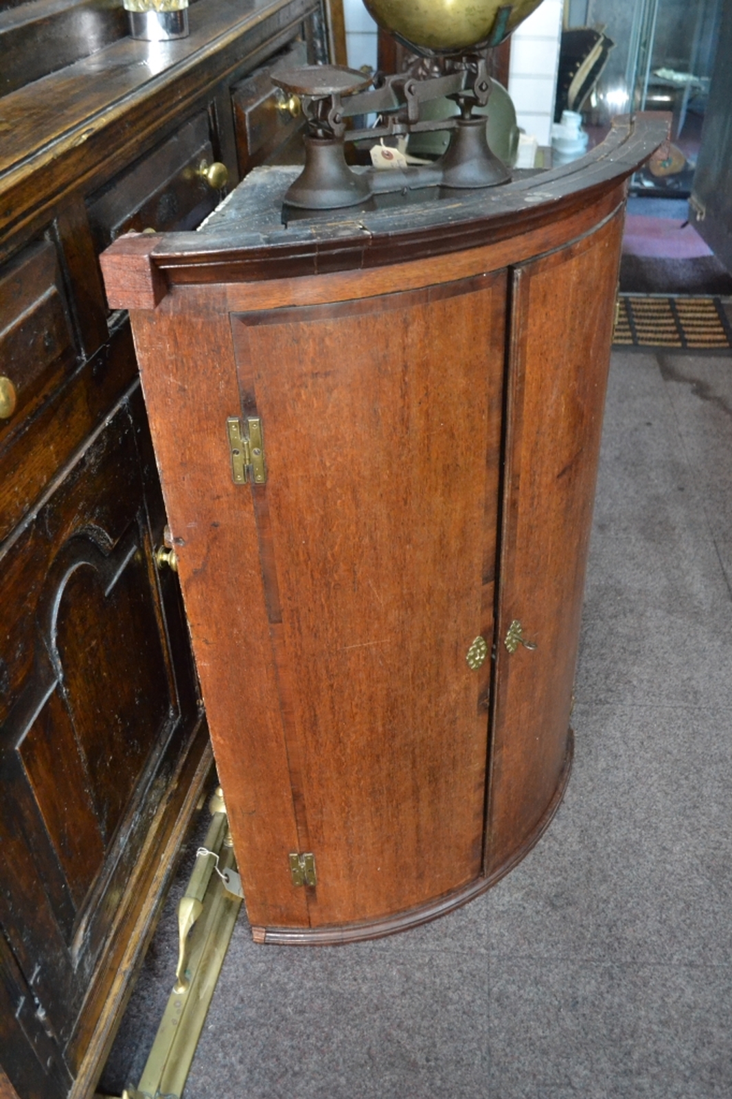 Georgian rounded front mahogany corner cupboard