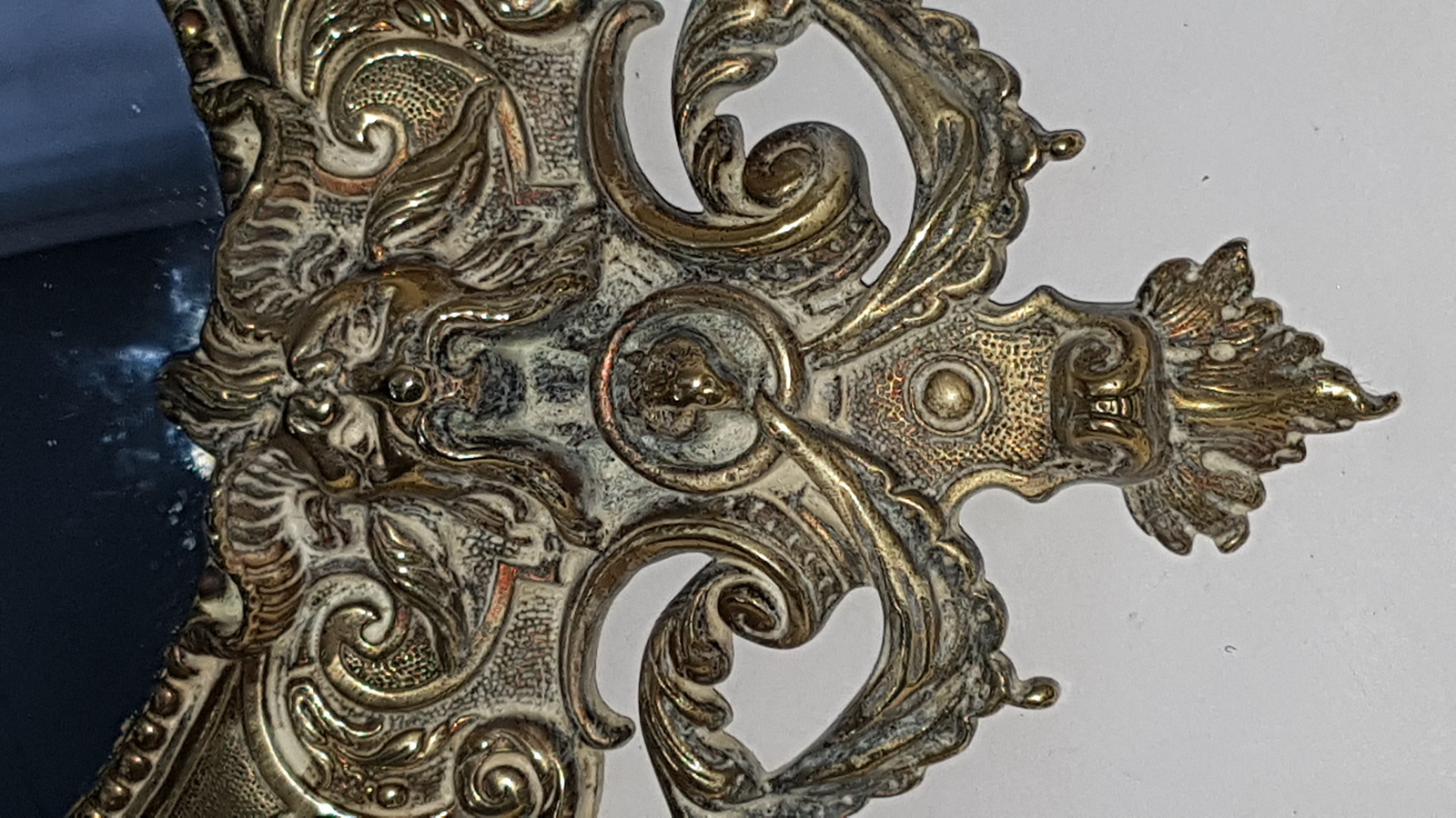 Discover our 19th-century cast brass convex wall mirror, embellished with intricate cherubs, satyr, and floral designs. Shop now for this unique 49cm x 37cm antique decor piece in excellent condition.