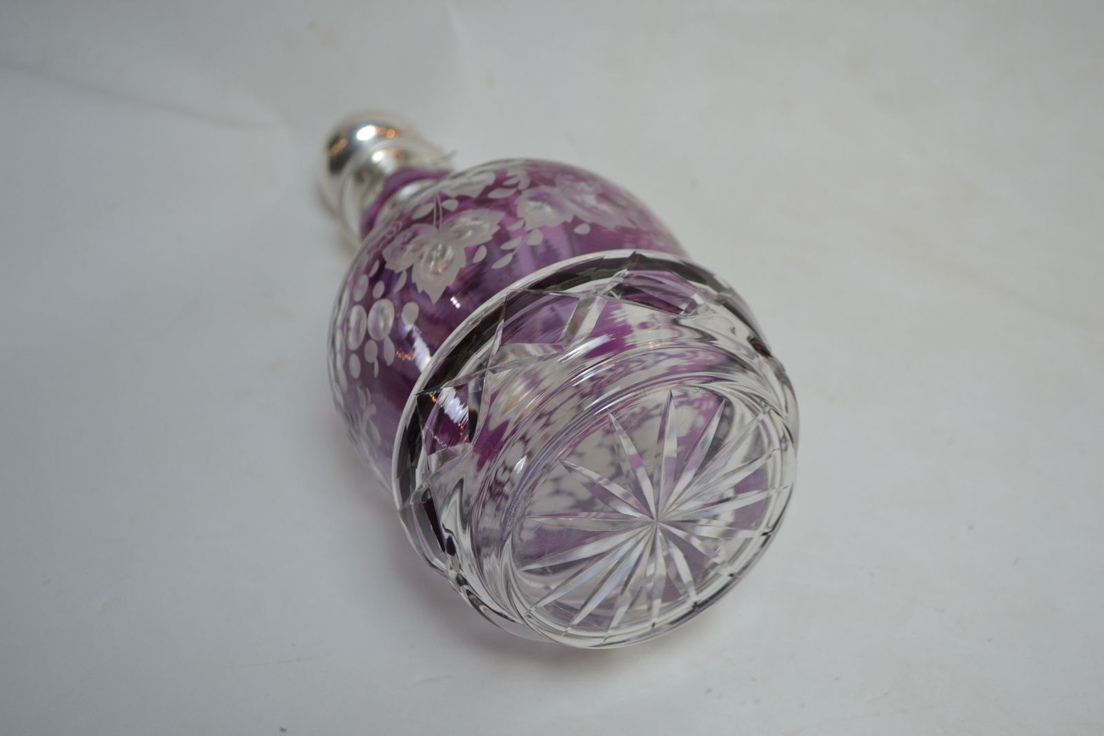 Discover our exquisite Continental silver and Bohemian glass decanter. 34cms high with a stunning purple glass overlay. Shop now for this unique find!