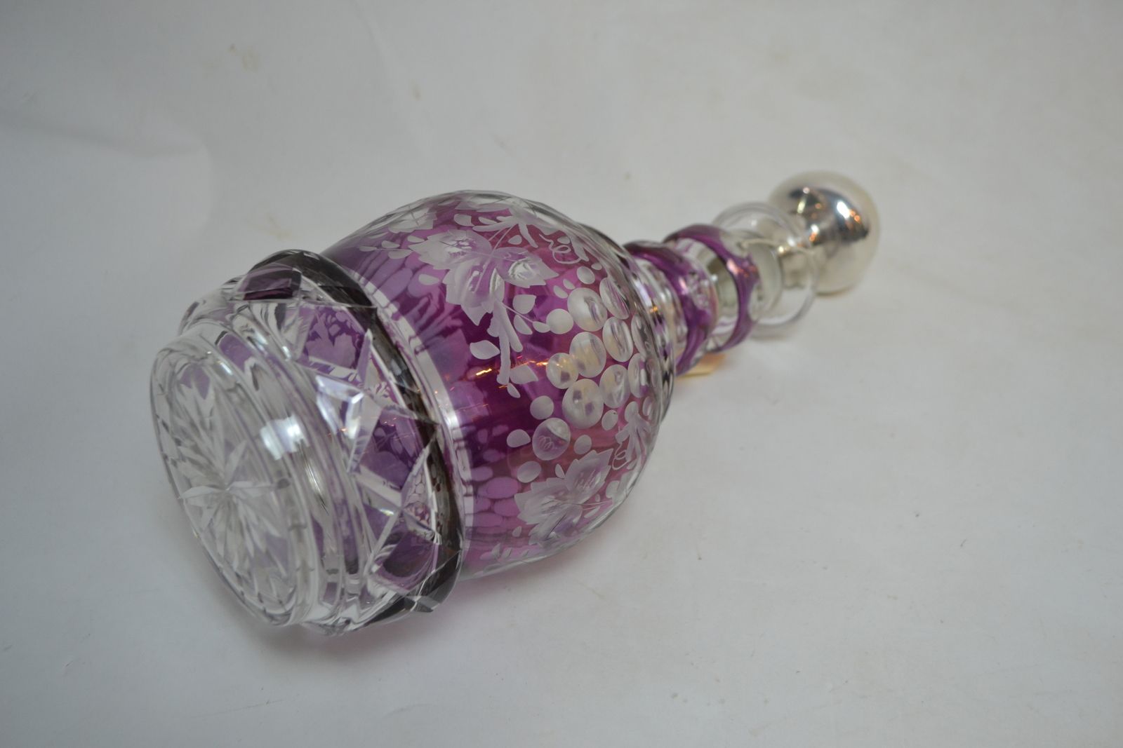 Discover our exquisite Continental silver and Bohemian glass decanter. 34cms high with a stunning purple glass overlay. Shop now for this unique find!