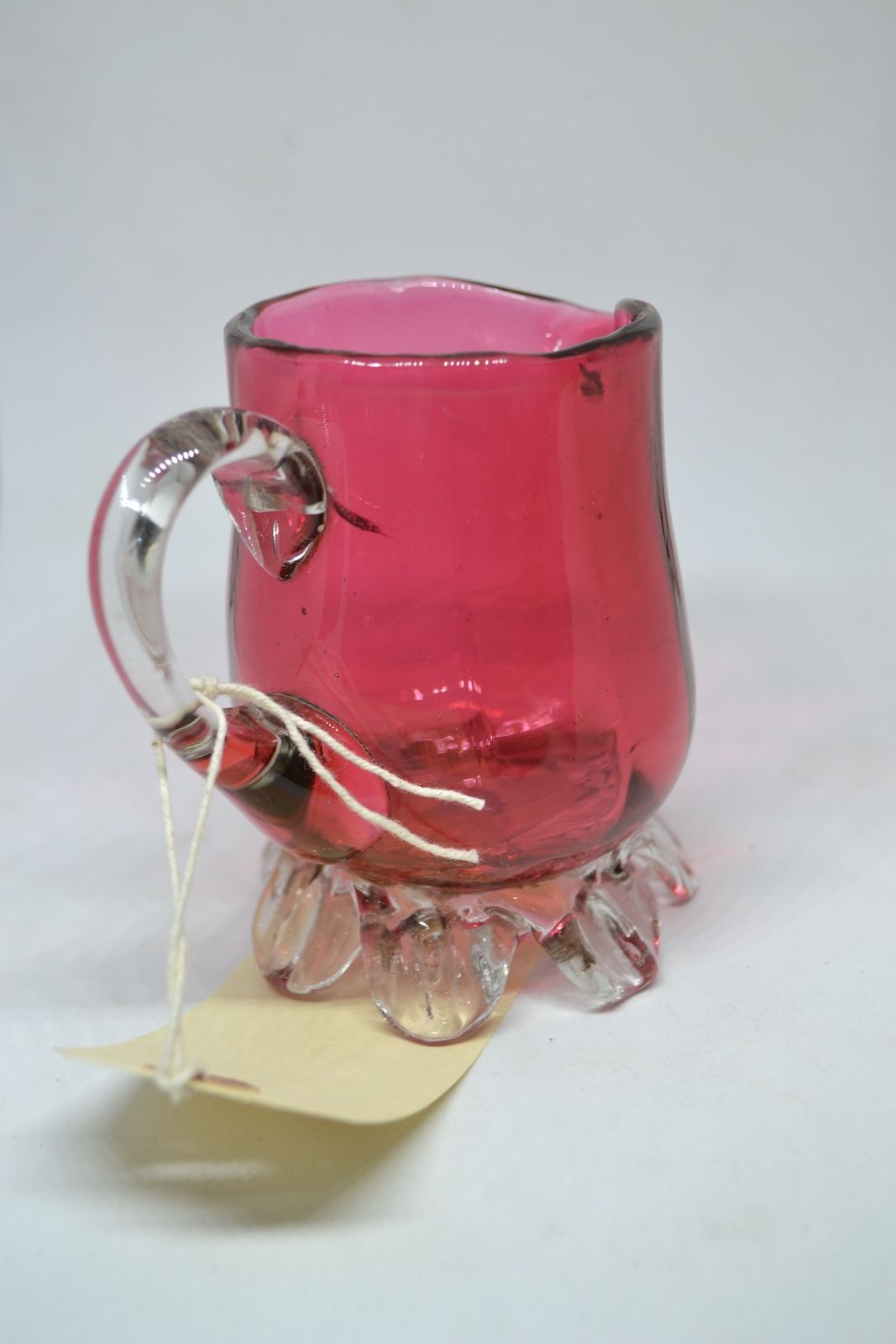 Discover our unique 1860 cranberry milk jug! Add a touch of vintage charm to your decor with this one-of-a-kind antique. Shop now and delve into history!
