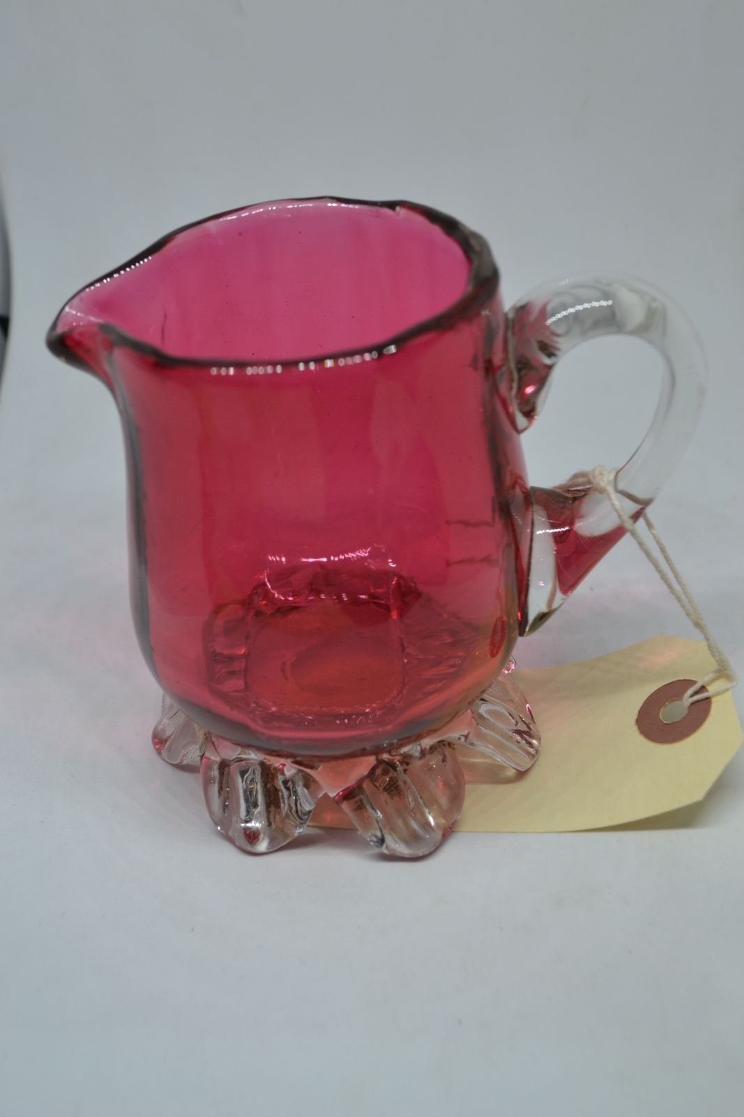 Discover our unique 1860 cranberry milk jug! Add a touch of vintage charm to your decor with this one-of-a-kind antique. Shop now and delve into history!