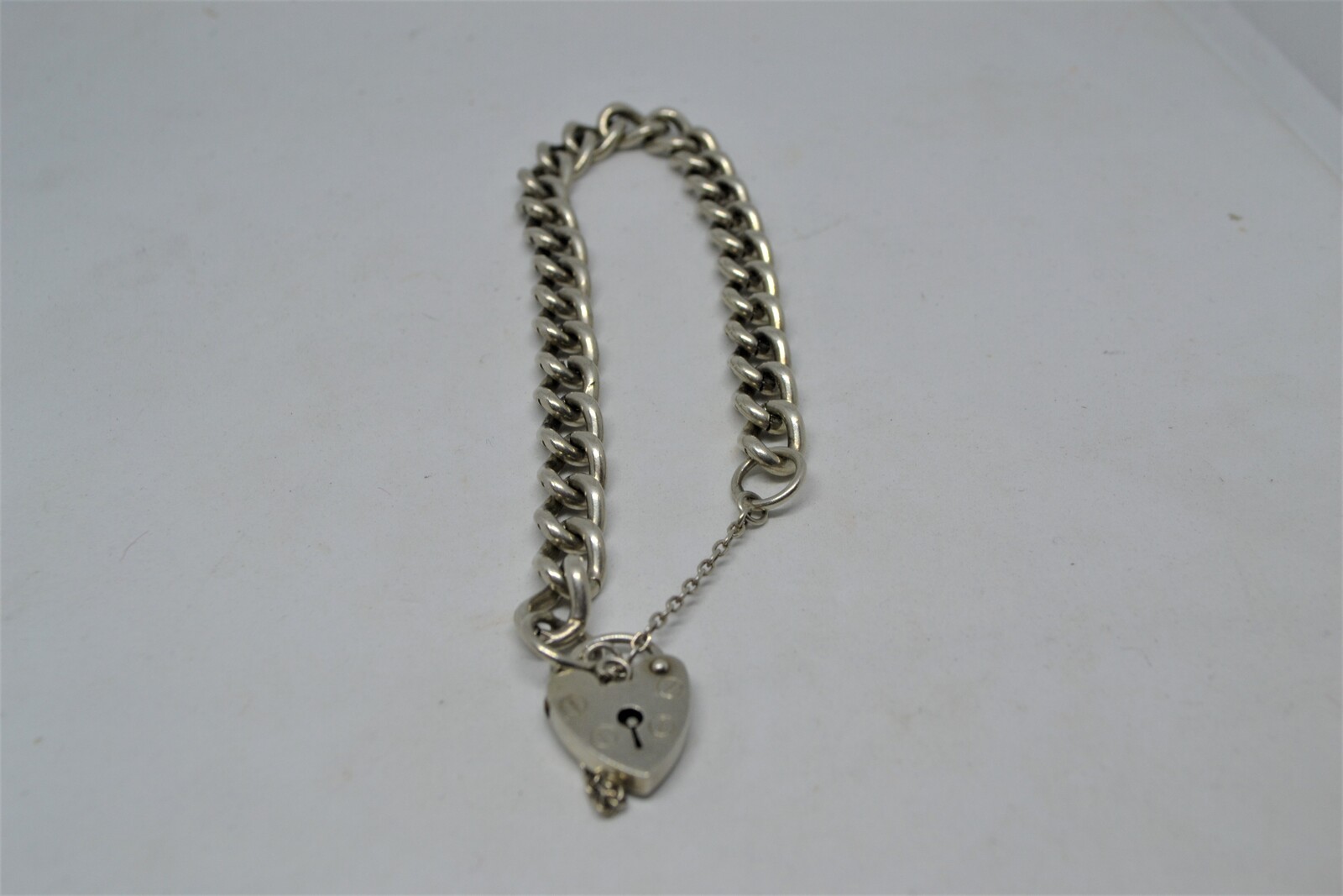 Solid Sterling Silver Curb Link Bracelet With Heart Padlock And Safety Chain.
