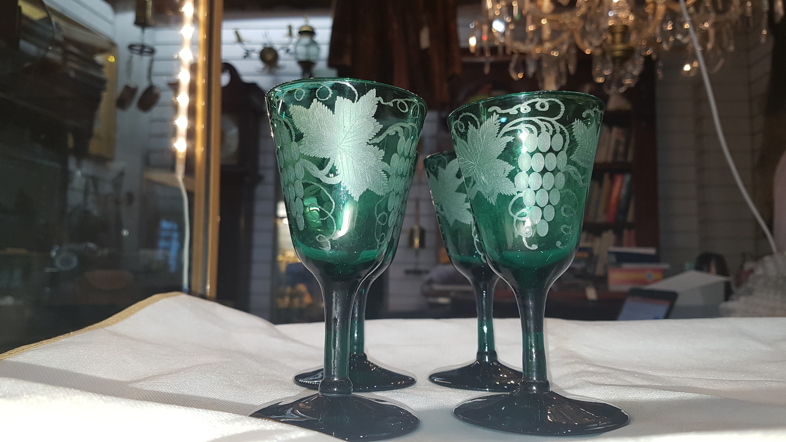 Discover our collection of 19th-century handblown Bristol green wine glasses. Engraved with unique vine leaves design and standing 13 cm high. Shop now for these one-of-a-kind pieces!
