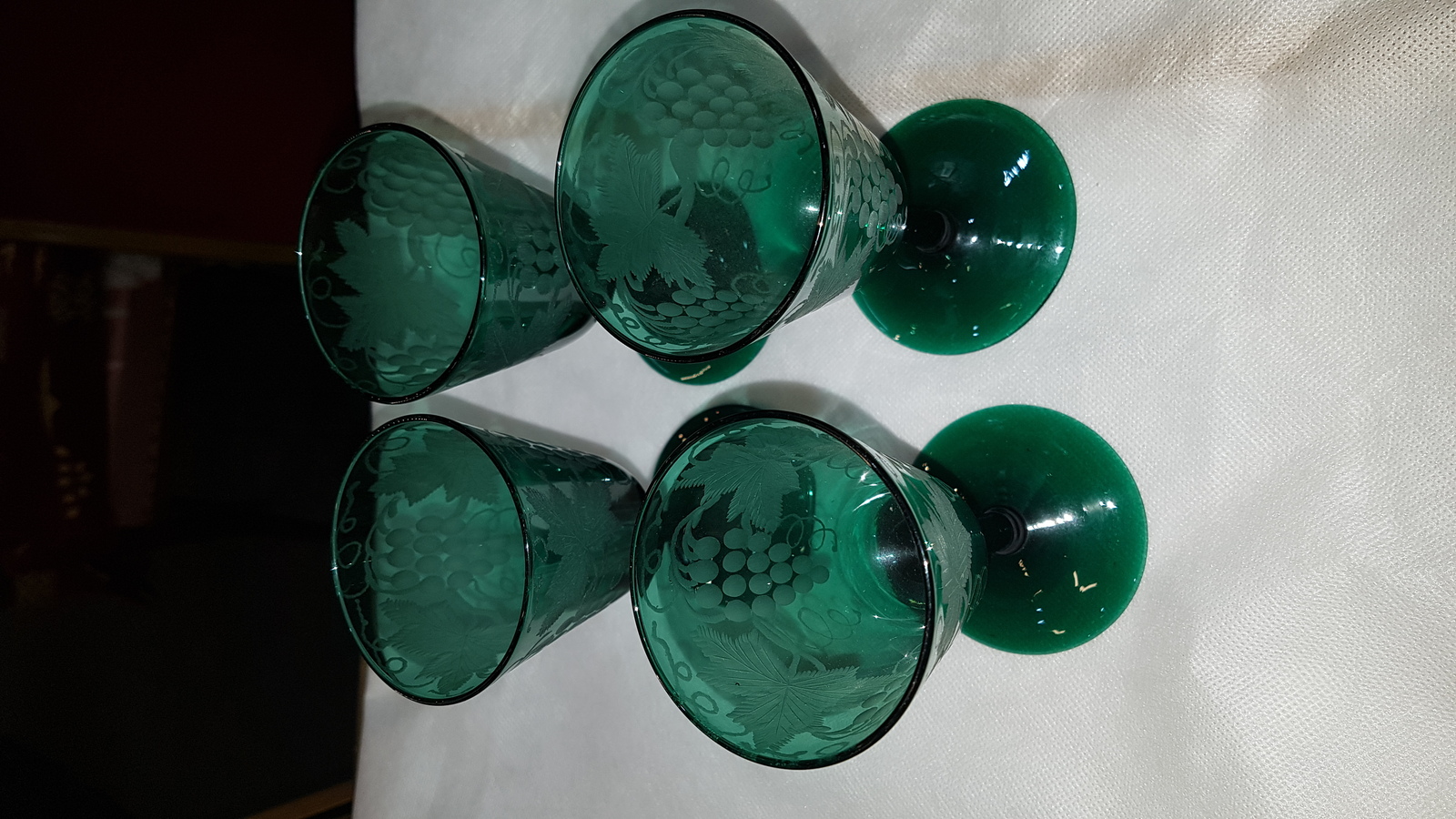Discover our collection of 19th-century handblown Bristol green wine glasses. Engraved with unique vine leaves design and standing 13 cm high. Shop now for these one-of-a-kind pieces!