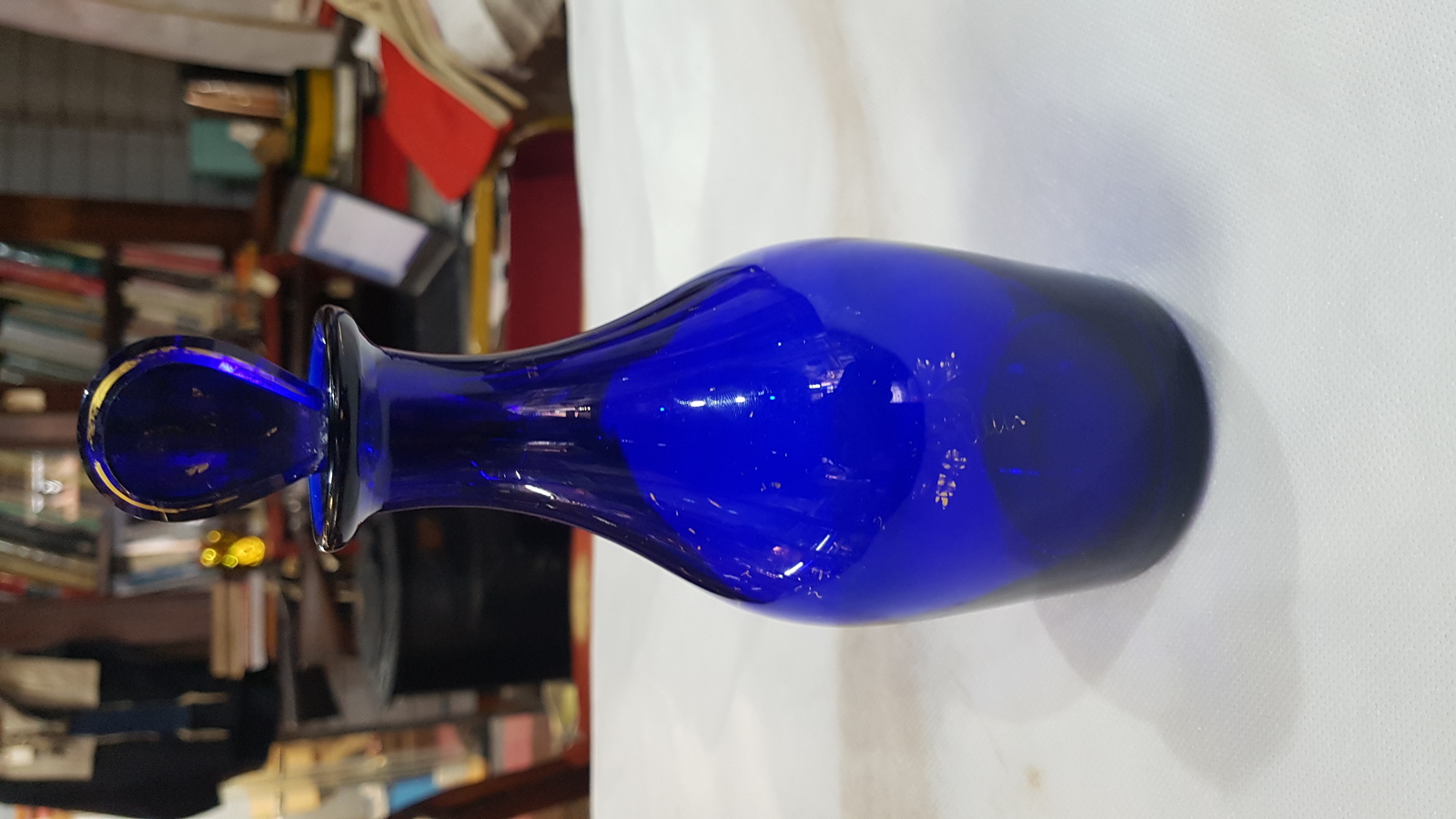 Discover our 19th c. Bristol blue decanter bottle with restored stopper. Unique gold lettering, size 9 inches. Shop now!