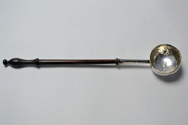 An 18th c. Silver Toddy Ladle With Wooden Handle.