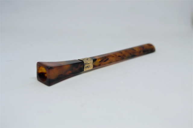 A Tortoise Shell Cigarette Holder With 9ct Gold Band.