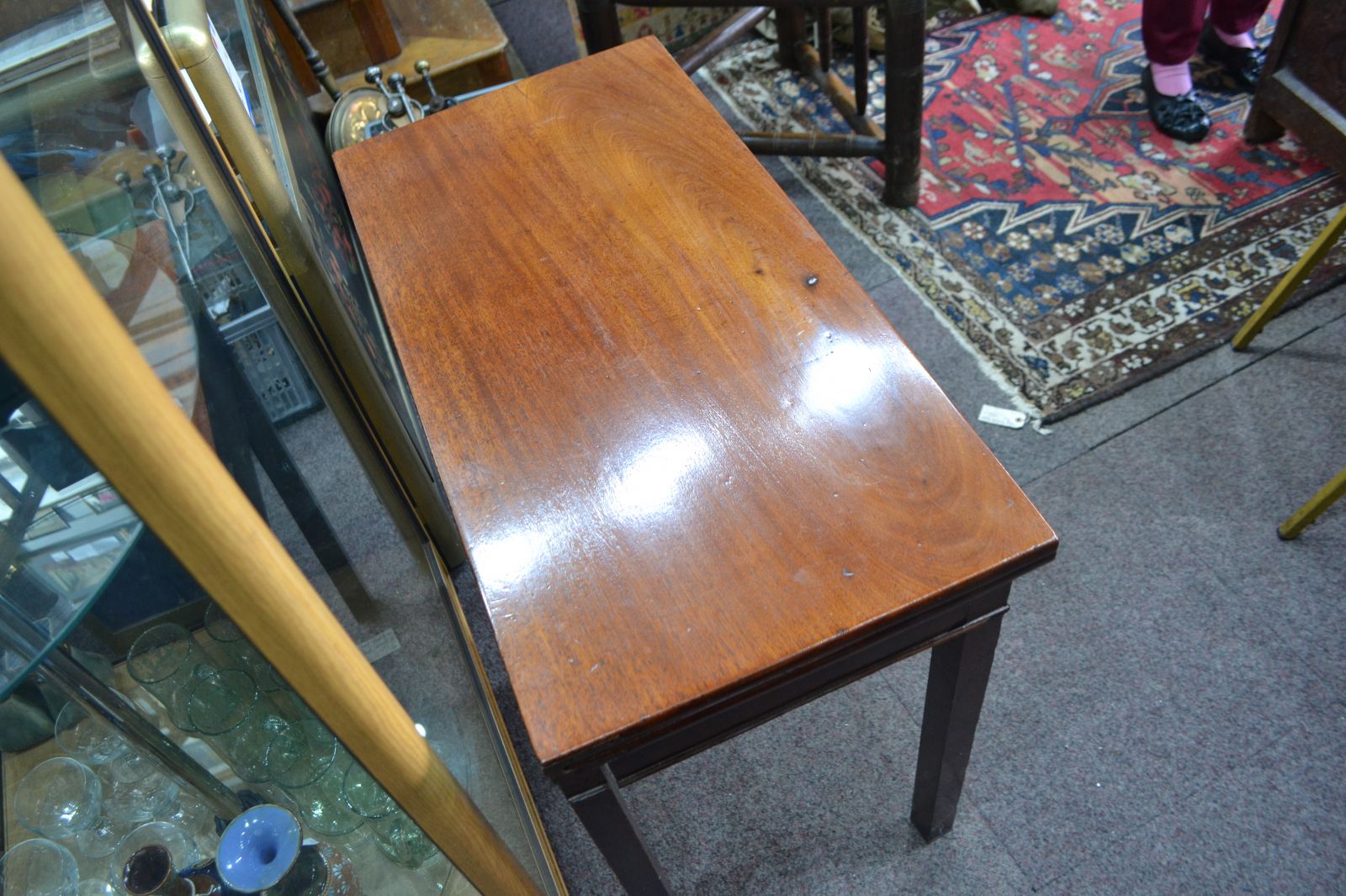 Discover our George III Mahogany card table. Despite wear on its green cover, it remains in reasonable condition. Shop now for vintage furniture delights!