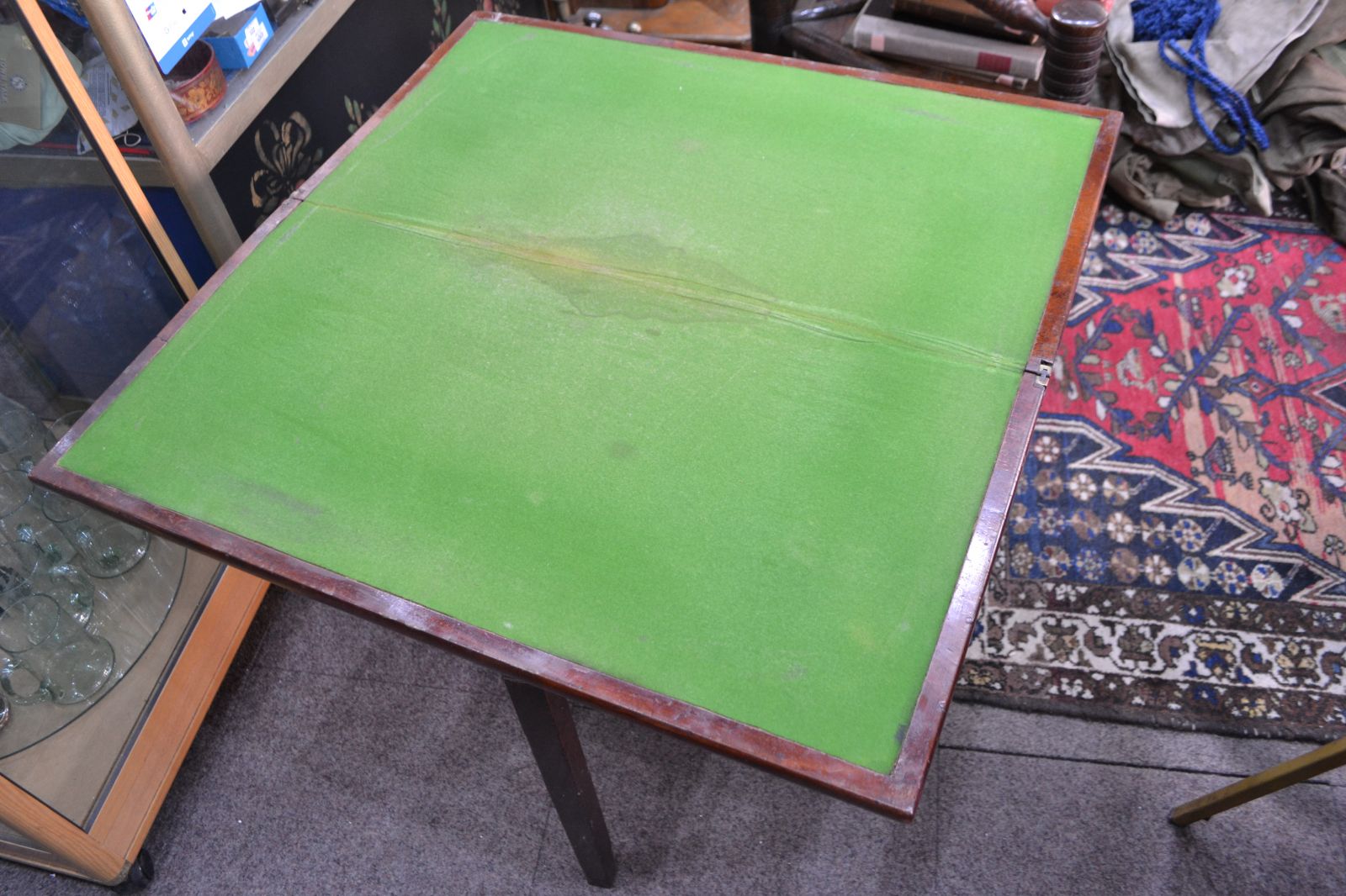 Discover our George III Mahogany card table. Despite wear on its green cover, it remains in reasonable condition. Shop now for vintage furniture delights!
