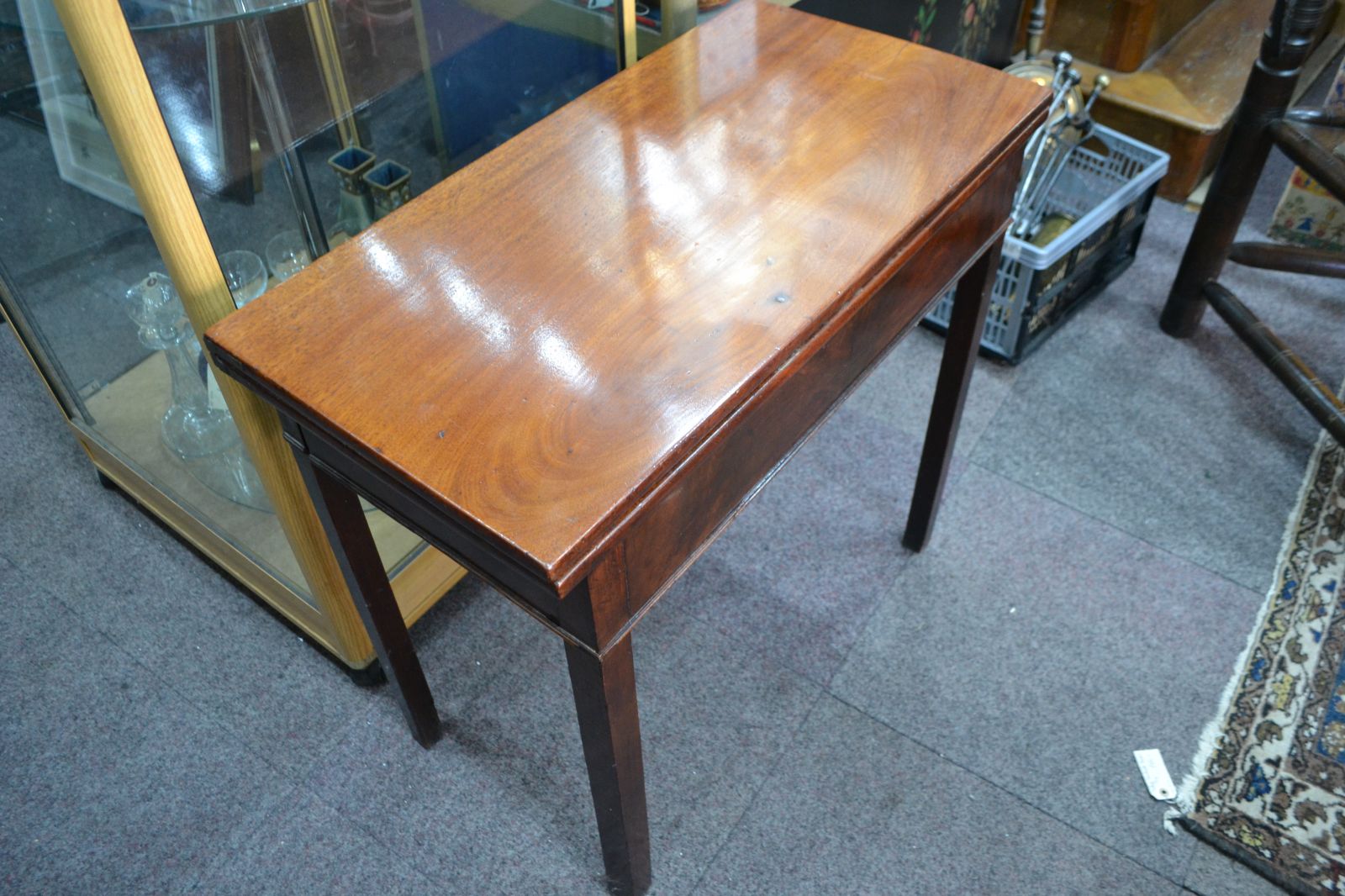 Discover our George III Mahogany card table. Despite wear on its green cover, it remains in reasonable condition. Shop now for vintage furniture delights!